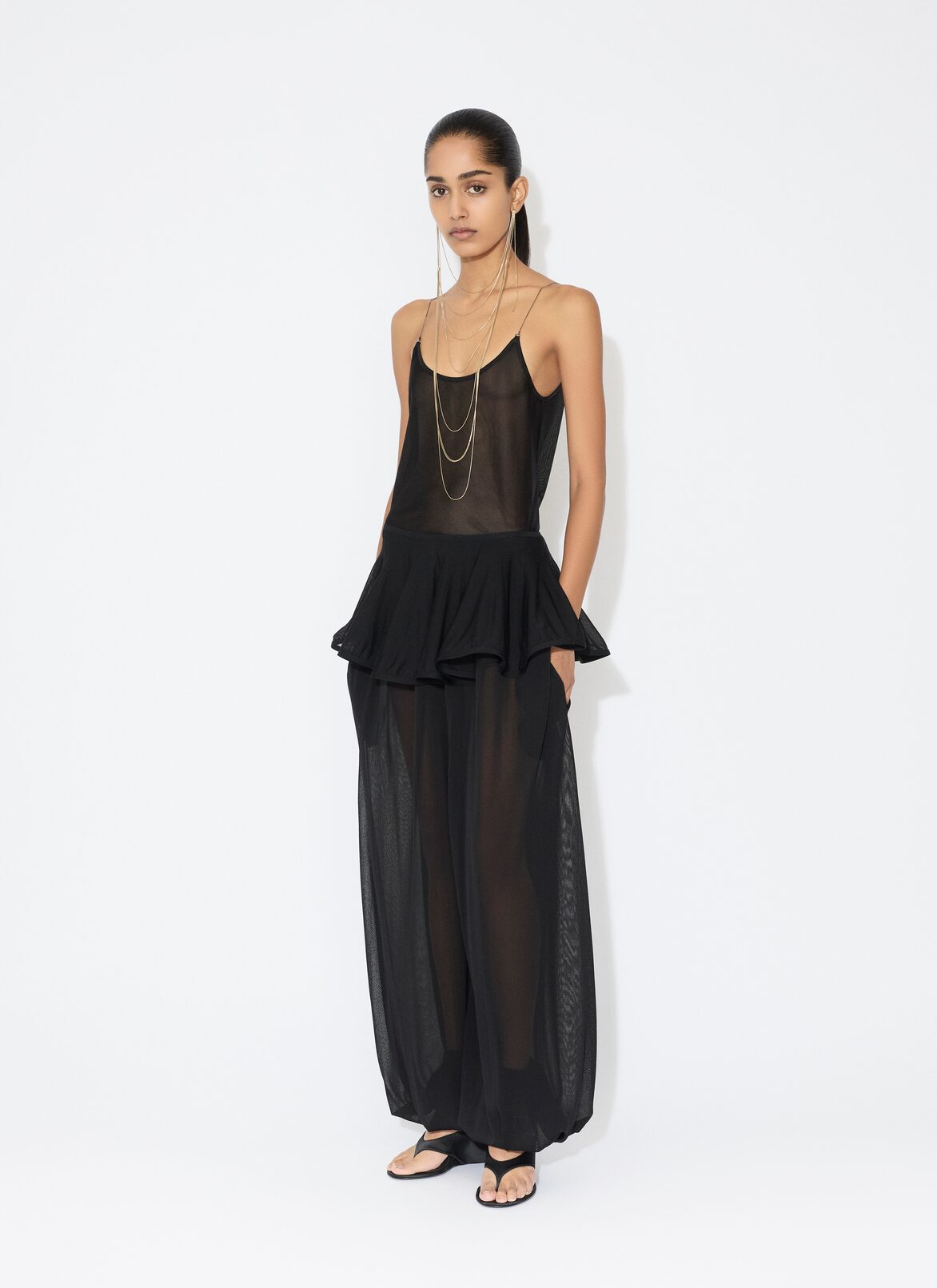 KNIT PEPLUM PANTS ALAÏA BLACK KNIT PEPLUM PANTS